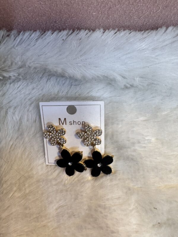 1751601250079 black flower earrings